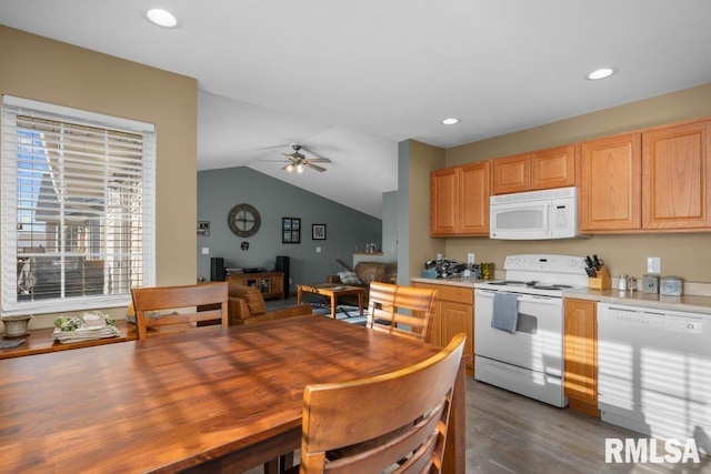 kitchen featuring ceiling fan, light brown cabinets, dark hardwood / wood-style flooring, lofted ceiling, and white appliances