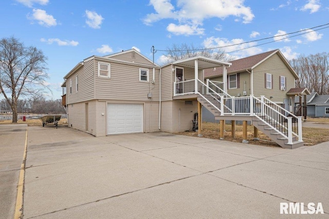 exterior space featuring a garage and a porch