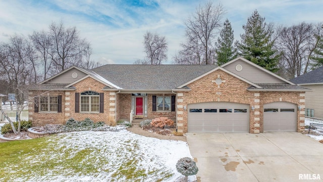 ranch-style home featuring a garage