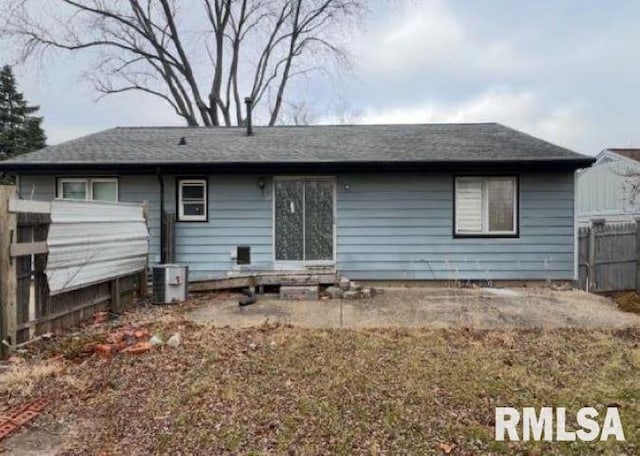 back of property featuring central AC unit