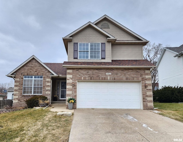 view of front property featuring a front yard and a garage