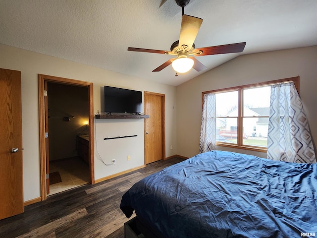 bedroom with ceiling fan, dark hardwood / wood-style floors, and vaulted ceiling