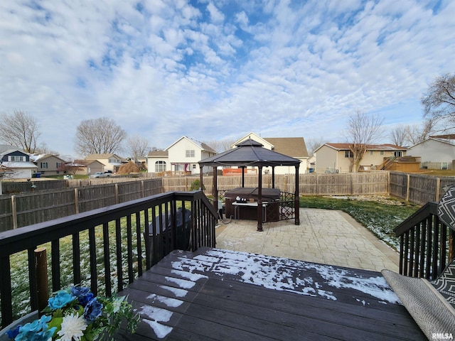 wooden deck with a gazebo, a yard, a hot tub, and area for grilling