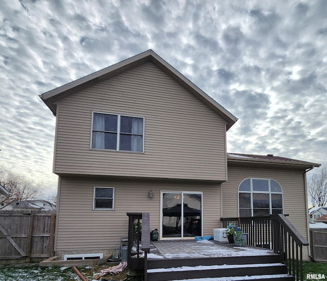 rear view of house featuring a deck