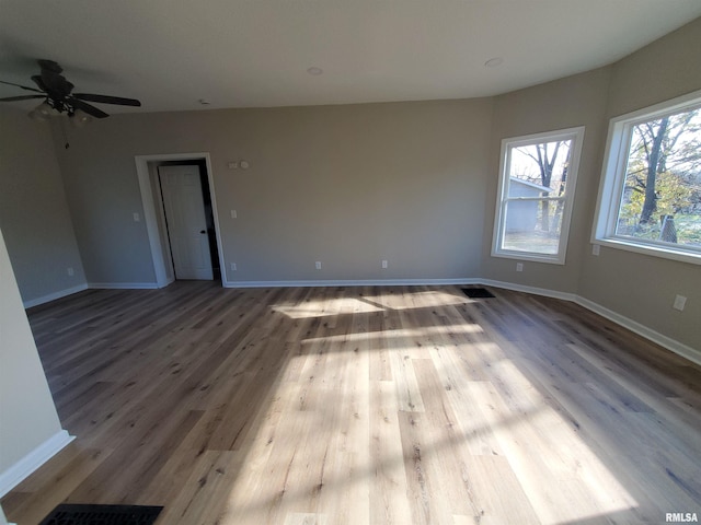 unfurnished room with light hardwood / wood-style flooring and ceiling fan