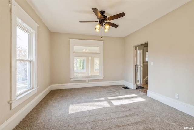 carpeted empty room with ceiling fan