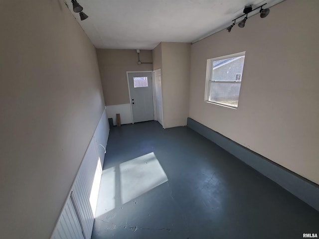 empty room with concrete flooring