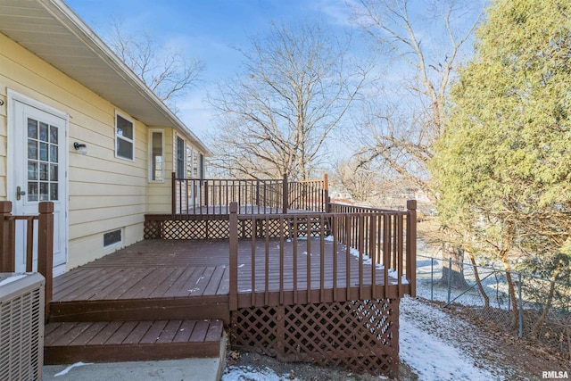 wooden deck featuring central AC unit