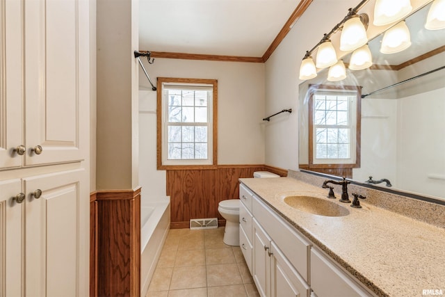 bathroom with tile patterned floors, vanity, crown molding, toilet, and wood walls