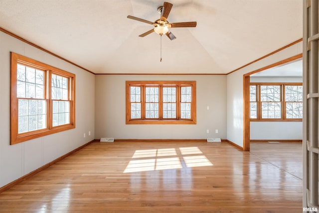 empty room featuring light wood-type flooring, ceiling fan, and lofted ceiling