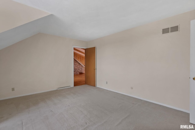 bonus room with light colored carpet and a baseboard heating unit