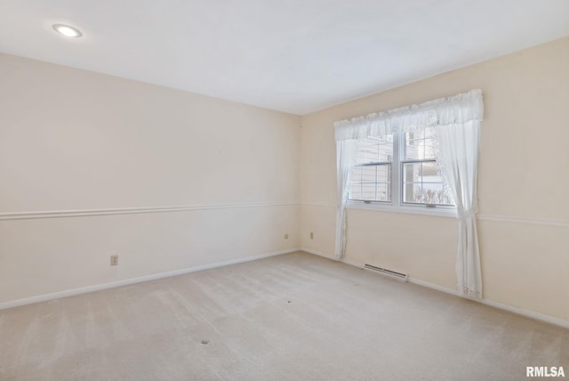 unfurnished room with light carpet