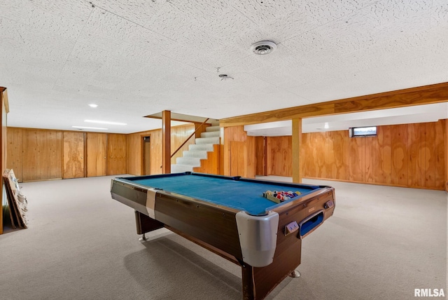 playroom with a textured ceiling, light colored carpet, wooden walls, and billiards