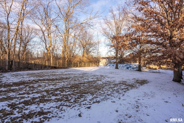 view of yard layered in snow