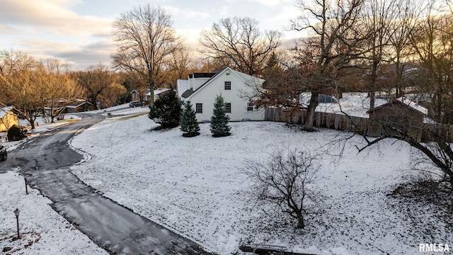 view of yard layered in snow