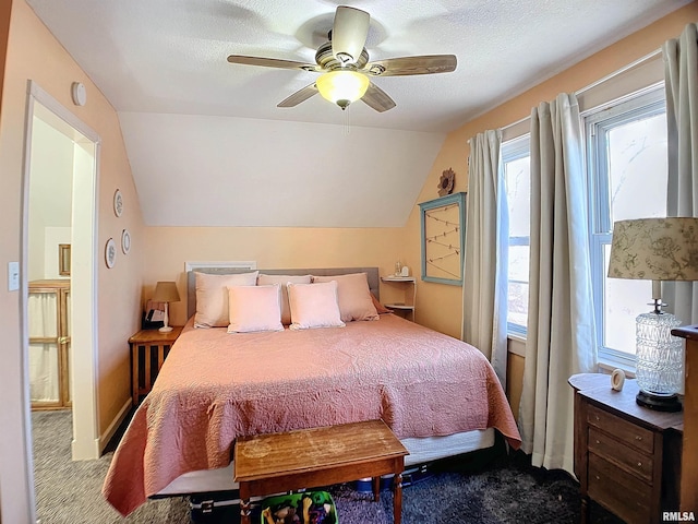 bedroom with ceiling fan, lofted ceiling, and light colored carpet