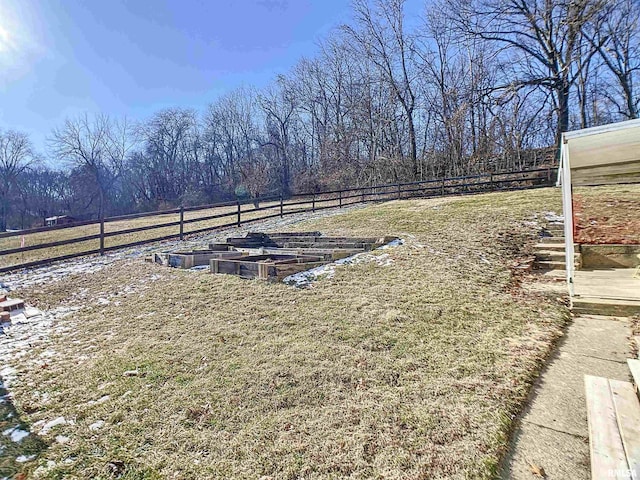 view of yard with a rural view