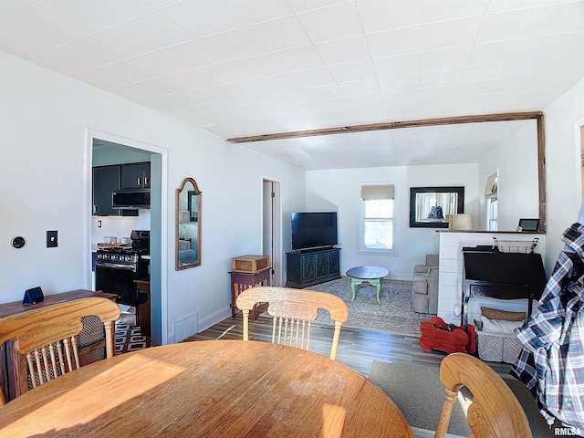 dining space with hardwood / wood-style floors