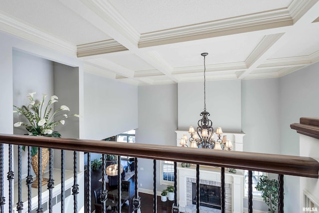 room details with beam ceiling, a brick fireplace, and coffered ceiling