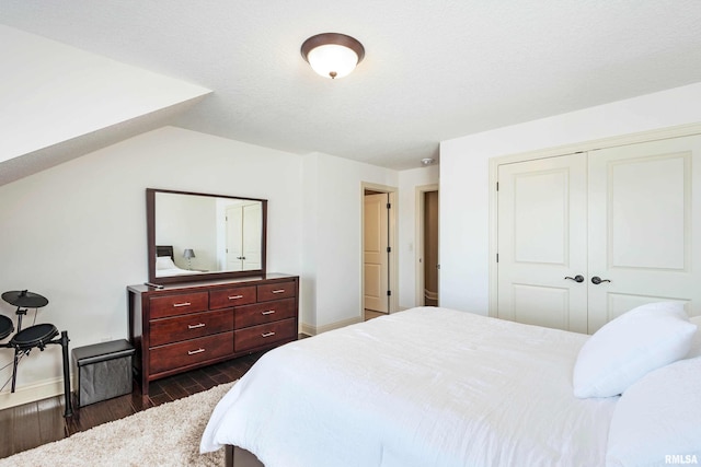 bedroom featuring dark hardwood / wood-style floors and a closet