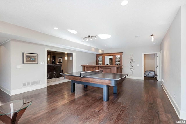 recreation room with dark wood-type flooring