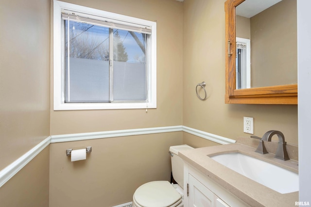 bathroom with toilet and vanity