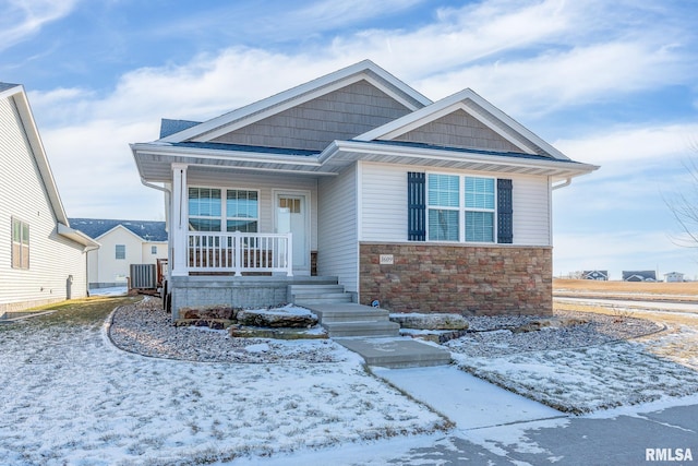 view of front of property featuring stone siding and covered porch