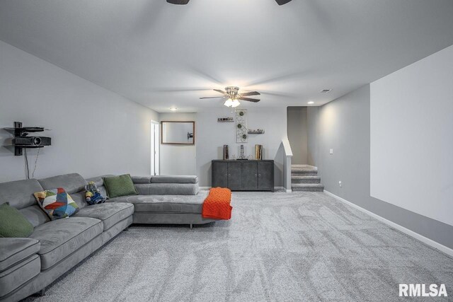 carpeted living room featuring ceiling fan