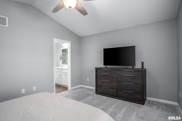 carpeted bedroom with vaulted ceiling, ceiling fan, and connected bathroom