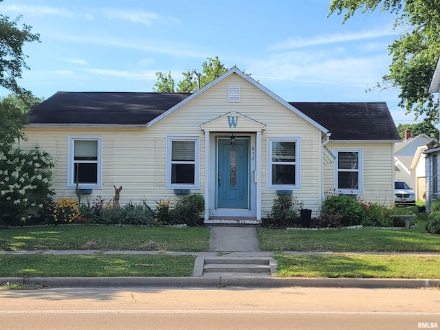 bungalow with a front yard