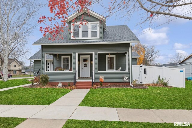 view of front facade with a porch and a front lawn