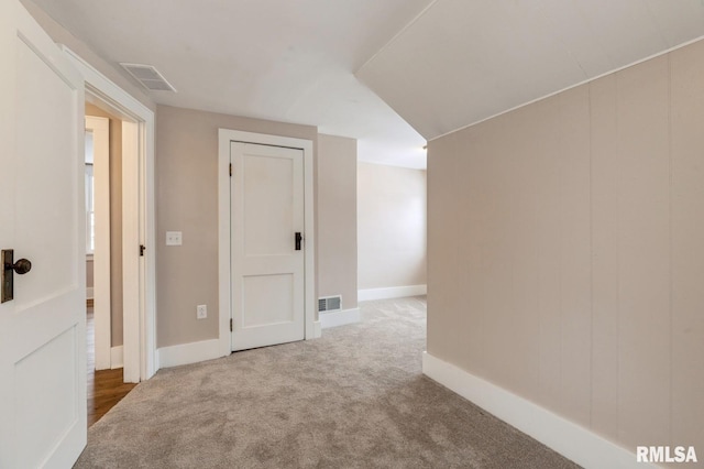 interior space with baseboards and visible vents