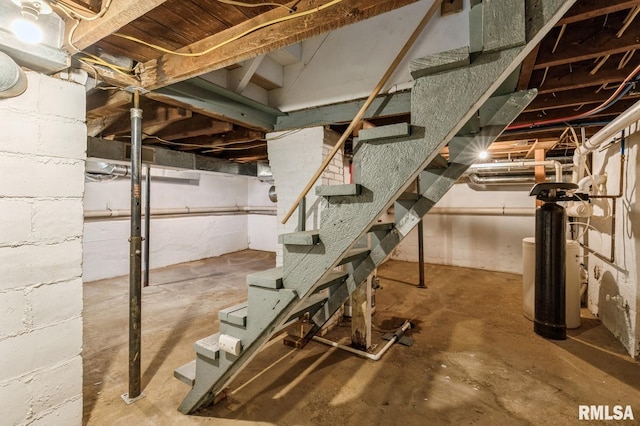 unfinished basement with stairway