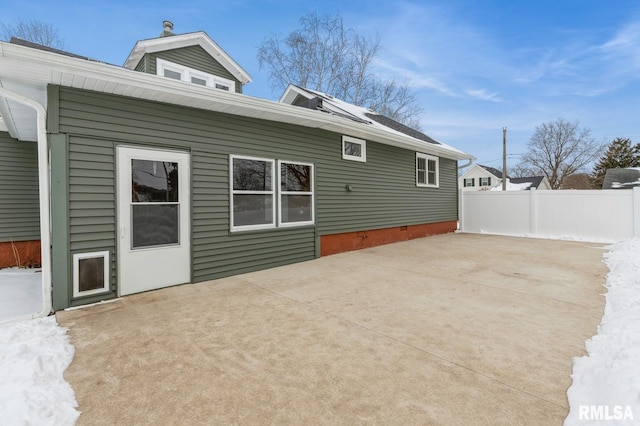 back of house featuring crawl space, a patio area, and fence