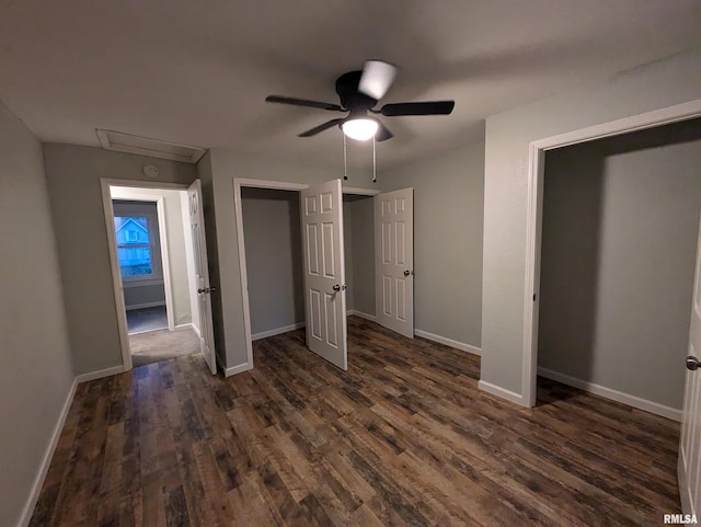 unfurnished bedroom with dark hardwood / wood-style flooring and ceiling fan