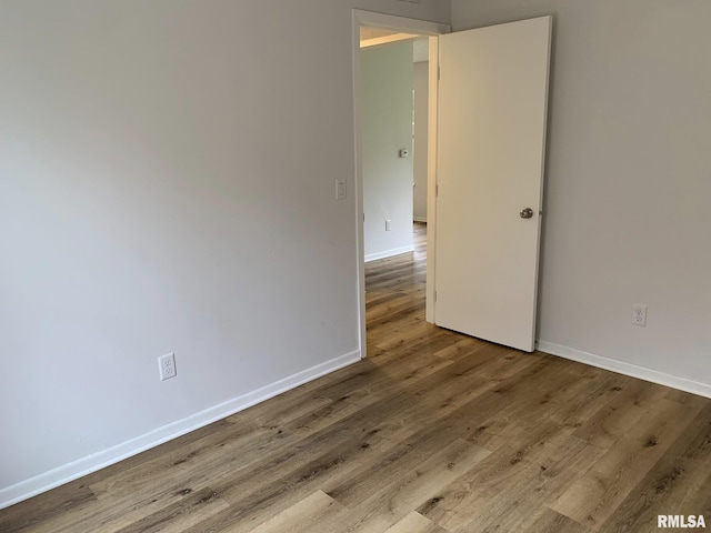 spare room featuring light wood-type flooring