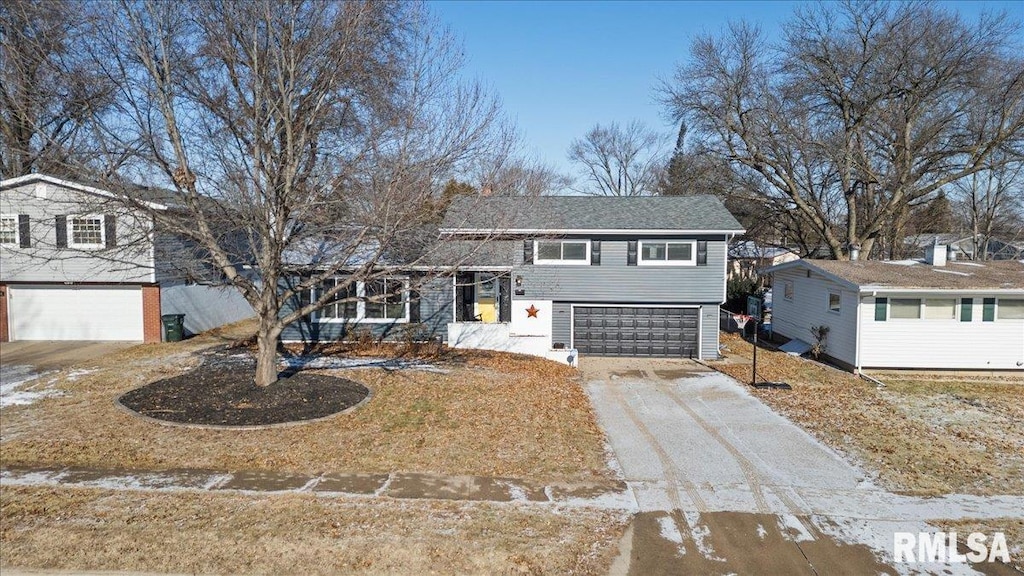 split level home with a garage