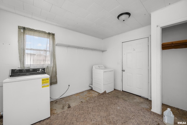 laundry room featuring washer / dryer and carpet flooring