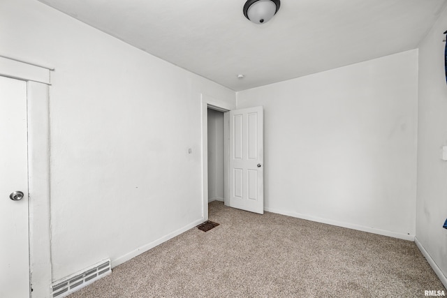 unfurnished bedroom featuring light colored carpet