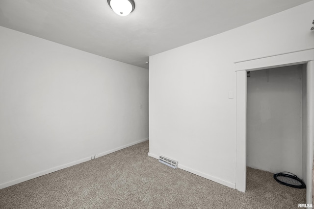 unfurnished bedroom with carpet flooring and a closet