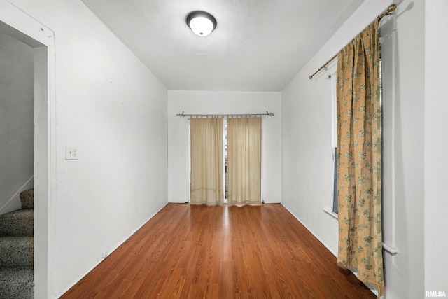 empty room with wood-type flooring