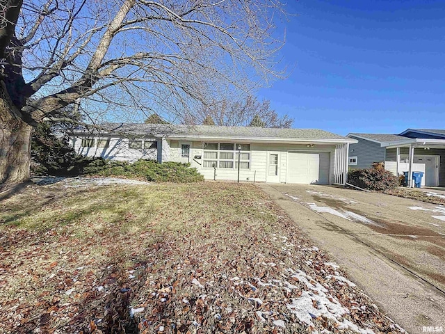 ranch-style house featuring a garage