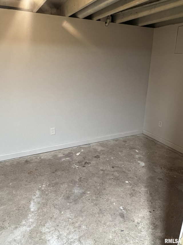 spare room featuring concrete flooring