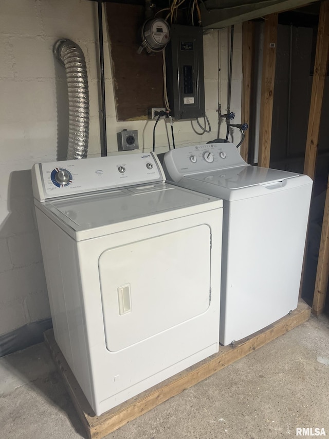 washroom with electric panel and independent washer and dryer