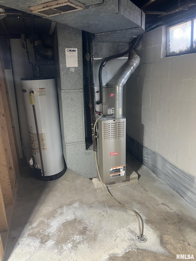 utility room with gas water heater