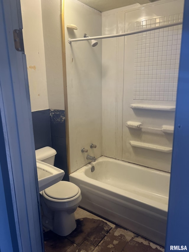 bathroom with toilet and tub / shower combination