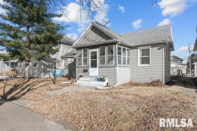 view of front of home featuring a sunroom