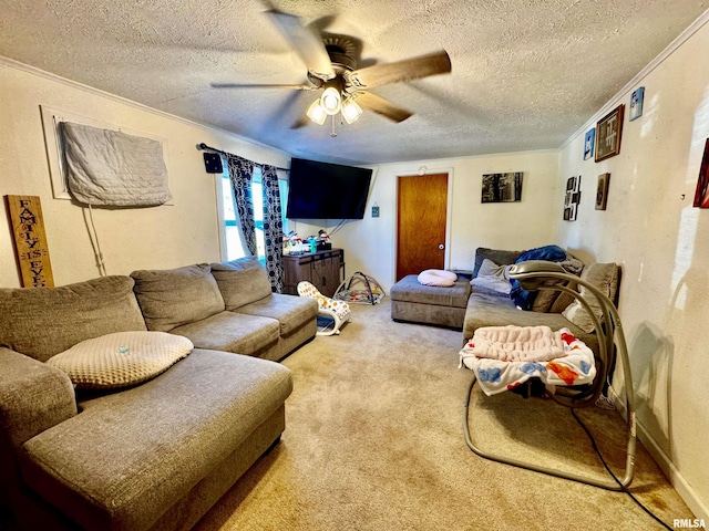 carpeted living room featuring a textured ceiling, ceiling fan, and ornamental molding