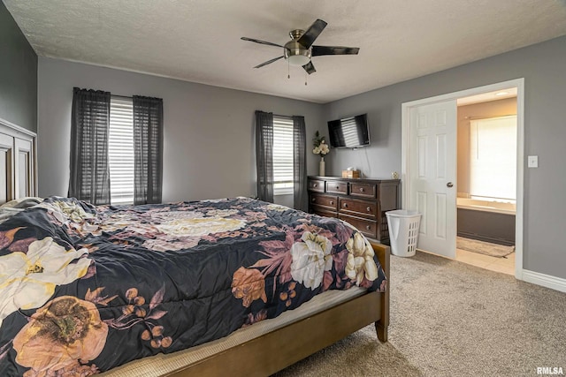 bedroom with light carpet, ceiling fan, a textured ceiling, and multiple windows