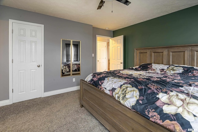 carpeted bedroom with ceiling fan and a textured ceiling